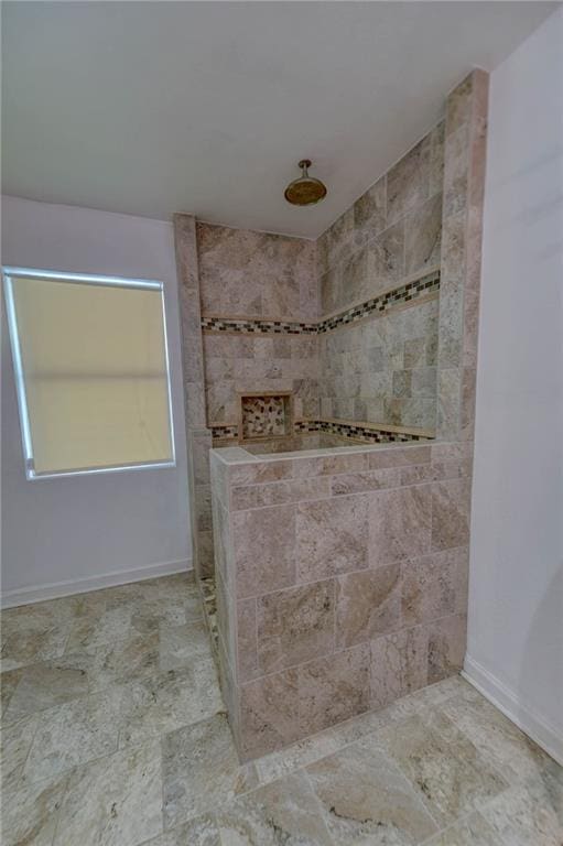 bathroom with tiled shower