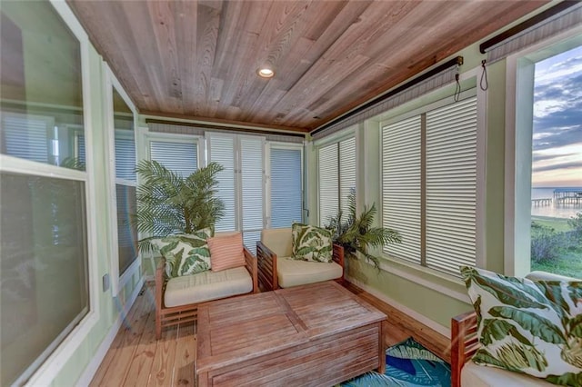 sunroom featuring wooden ceiling