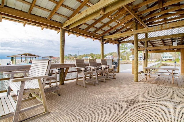 wooden deck featuring a water view