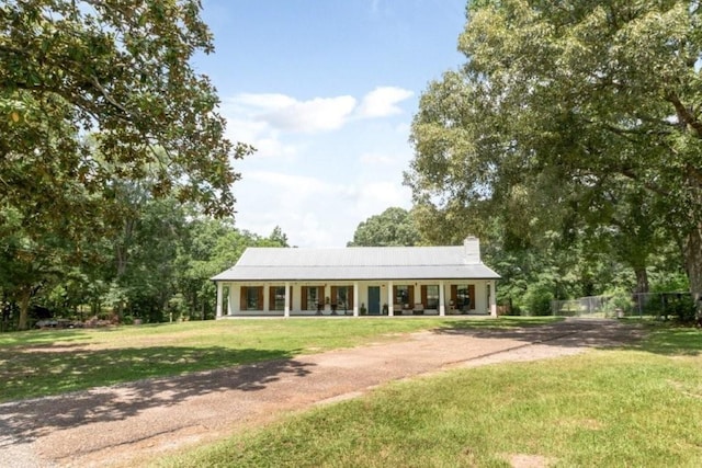 11525 Lott Rd, Chunchula, AL 36521 - rear view of property with driveway, a chimney, and covered porch