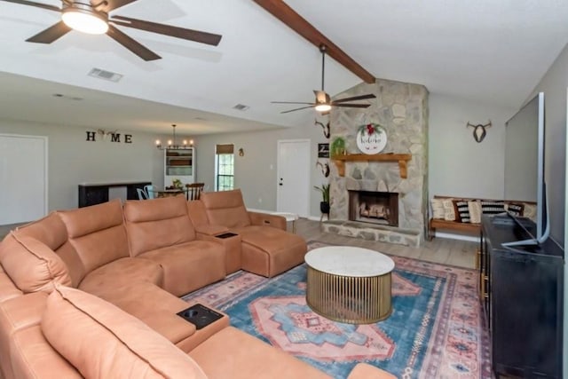 11525 Lott Rd, Chunchula, AL 36521 - living area featuring a ceiling fan, a chandelier, wood finished floors, and a stone fireplace
