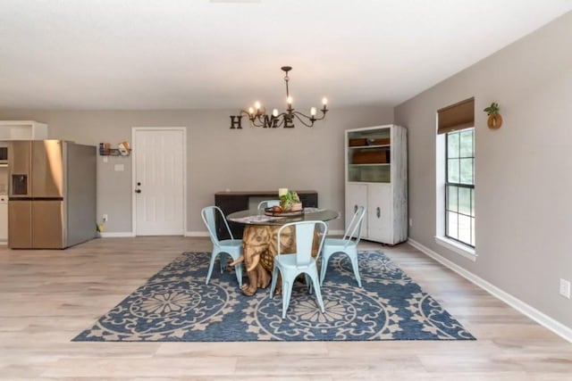 11525 Lott Rd, Chunchula, AL 36521 - dining space featuring a chandelier and wood finished floors