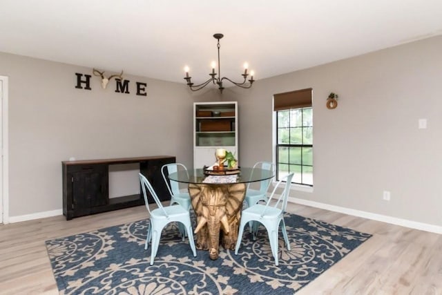 11525 Lott Rd, Chunchula, AL 36521 - dining room featuring a chandelier and wood finished floors