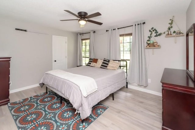 11525 Lott Rd, Chunchula, AL 36521 - bedroom with light wood-type flooring and ceiling fan