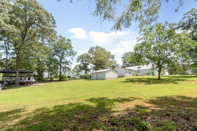 11525 Lott Rd, Chunchula, AL 36521 - view of green lawn with an outbuilding and an outdoor structure