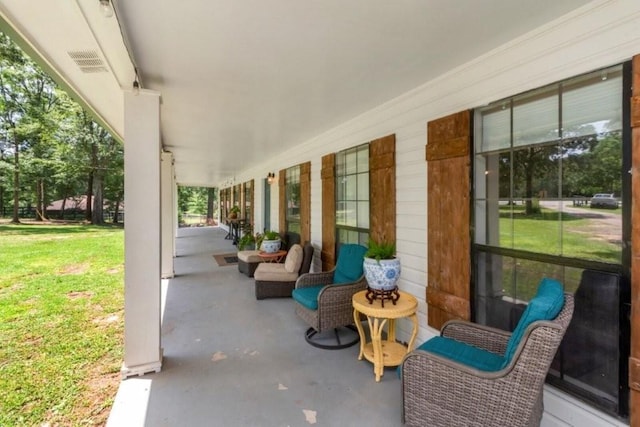 11525 Lott Rd, Chunchula, AL 36521 - covered porch featuring a lawn