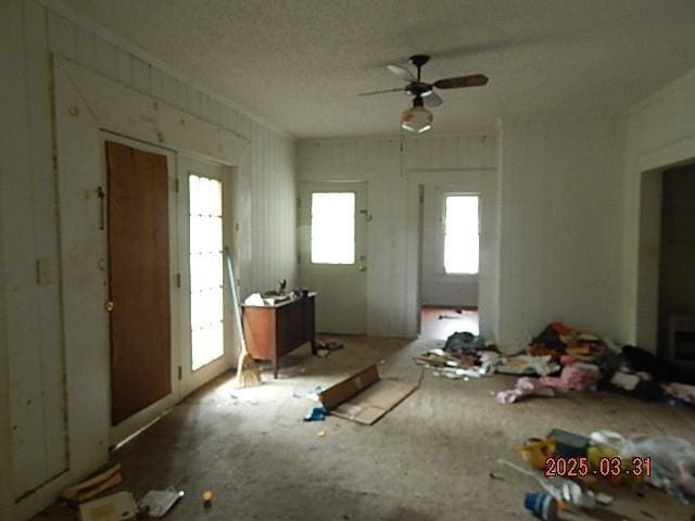 interior space with a ceiling fan