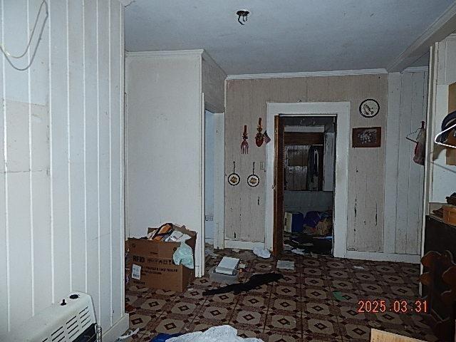 miscellaneous room with tile patterned floors and crown molding