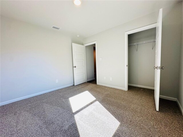 bathroom with a washtub, vanity, and wood-type flooring