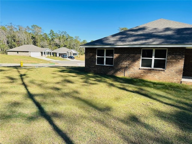 view of home's exterior featuring a yard