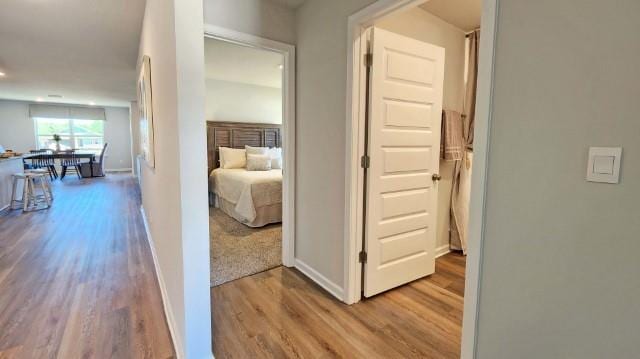 corridor featuring light hardwood / wood-style floors