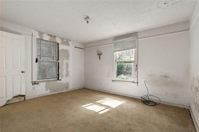 672 Burden St, Mobile, AL 36607 - spare room with carpet, a textured ceiling, and baseboards