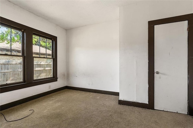 672 Burden St, Mobile, AL 36607 - carpeted spare room featuring baseboards