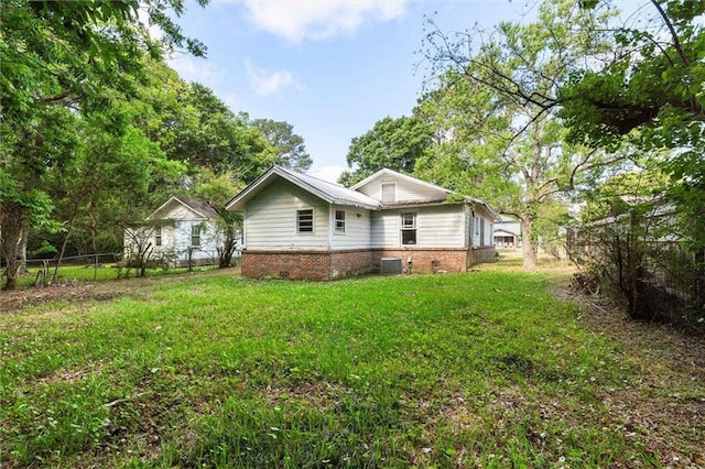 672 Burden St, Mobile, AL 36607 - rear view of property with brick siding and central AC unit