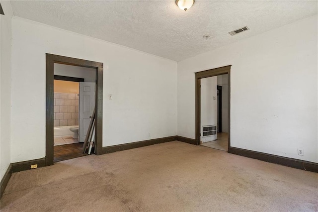 672 Burden St, Mobile, AL 36607 - unfurnished room with carpet flooring, baseboards, and a textured ceiling