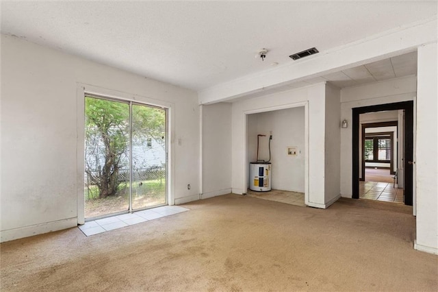 672 Burden St, Mobile, AL 36607 - unfurnished living room featuring electric water heater, carpet, and plenty of natural light