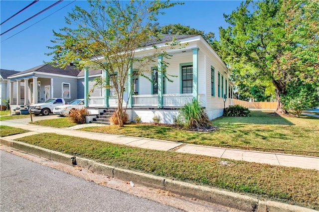 view of front facade with a porch and a front lawn