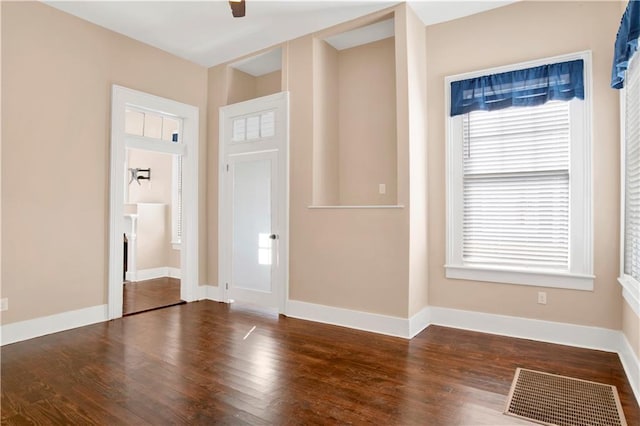 interior space with dark hardwood / wood-style floors