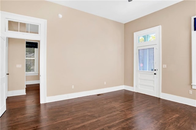 foyer with dark hardwood / wood-style floors