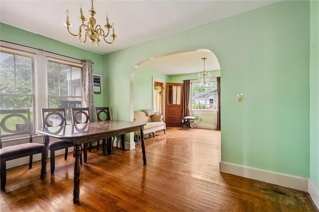 dining space featuring a chandelier and hardwood / wood-style flooring