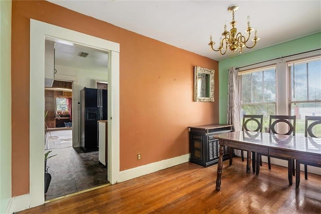 interior space featuring hardwood / wood-style flooring and a chandelier