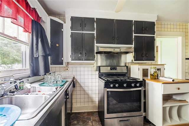 kitchen with tile walls, sink, and stainless steel range with gas stovetop