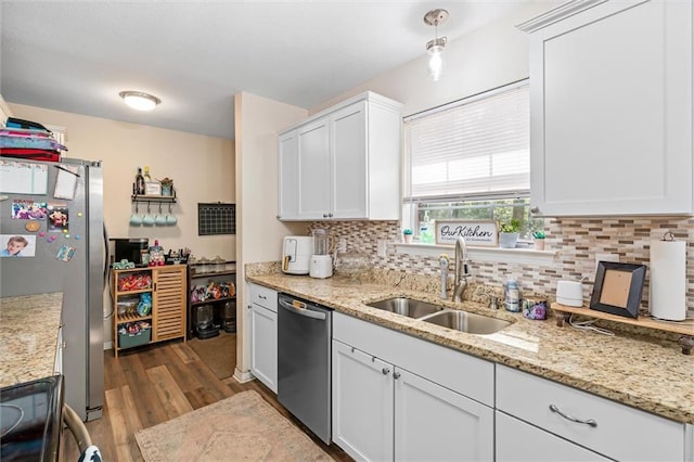 kitchen with white cabinetry, stainless steel appliances, and sink