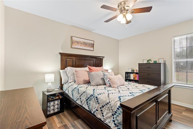 bedroom featuring hardwood / wood-style flooring and ceiling fan