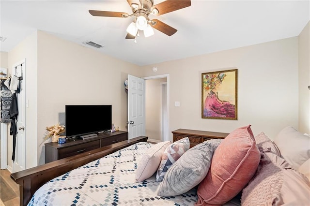 bedroom with hardwood / wood-style flooring and ceiling fan