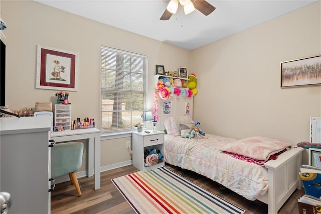 bedroom with ceiling fan and dark hardwood / wood-style floors