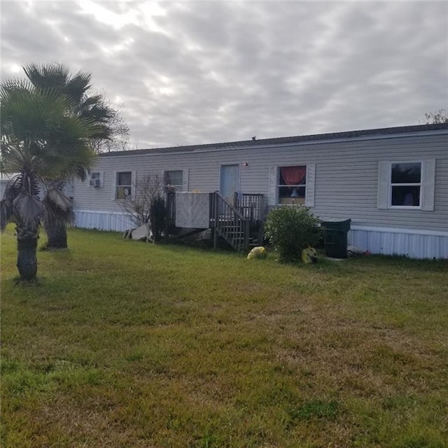 rear view of house with a yard