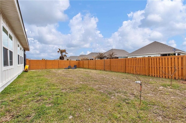 view of yard with a fenced backyard