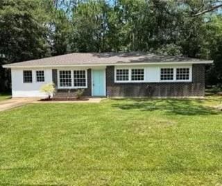 ranch-style house with a front yard