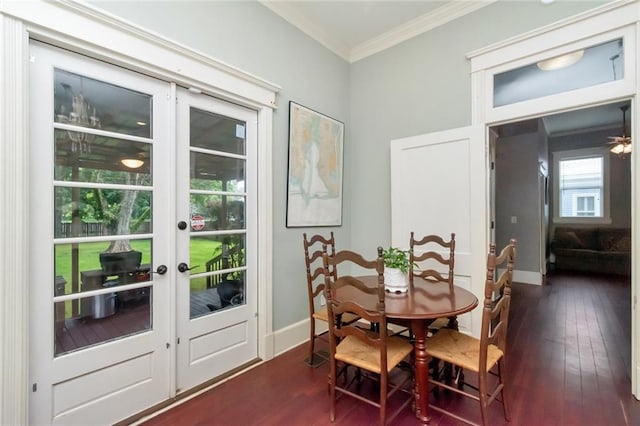 dining area featuring dark wood-type flooring, french doors, and crown molding