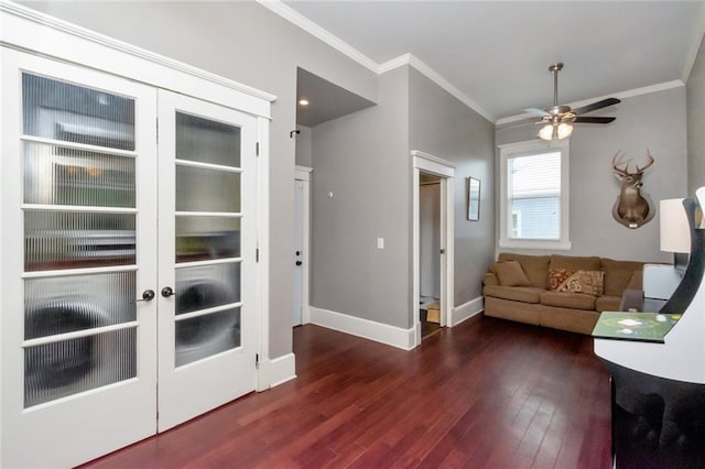 living room with crown molding, wood-type flooring, french doors, and ceiling fan