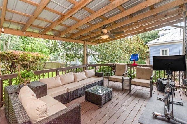 wooden terrace with outdoor lounge area and ceiling fan