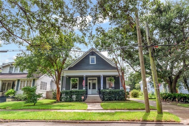 view of front of house featuring a porch and a front lawn