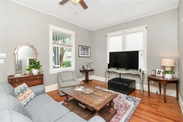 living room featuring crown molding, ceiling fan, and hardwood / wood-style floors