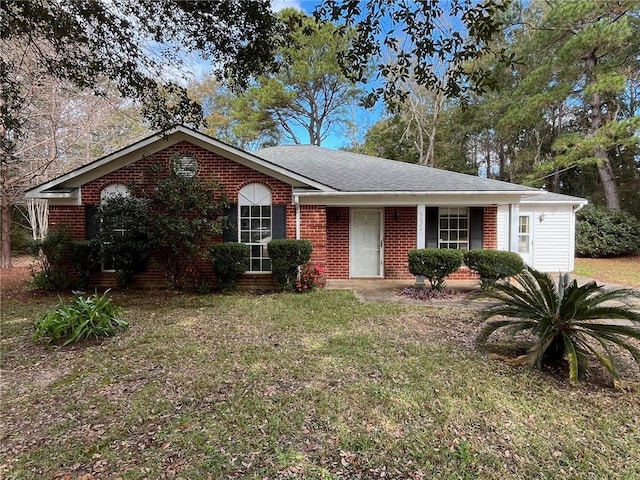 ranch-style home with a front yard