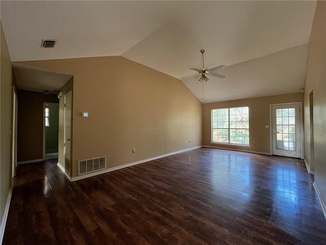 spare room featuring ceiling fan, dark wood-type flooring, and vaulted ceiling