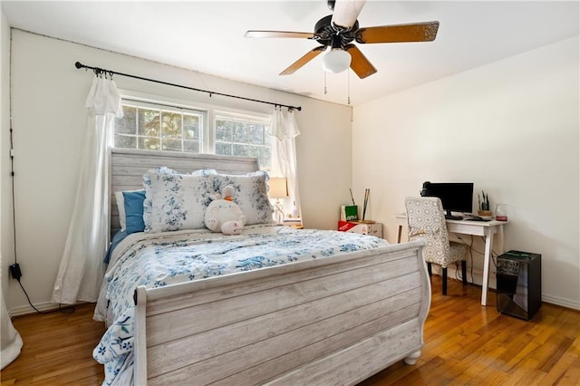 bedroom with hardwood / wood-style flooring and ceiling fan