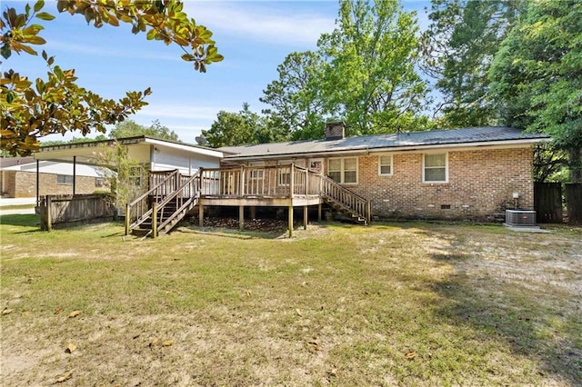 back of property with crawl space, brick siding, stairway, and a wooden deck