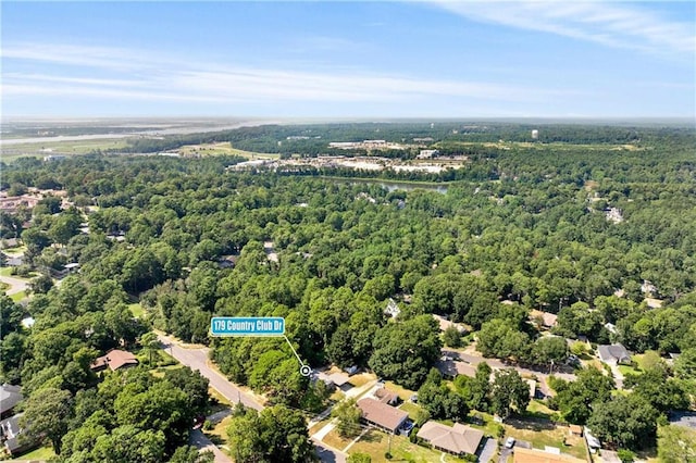 bird's eye view featuring a forest view