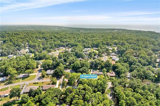 aerial view featuring a view of trees