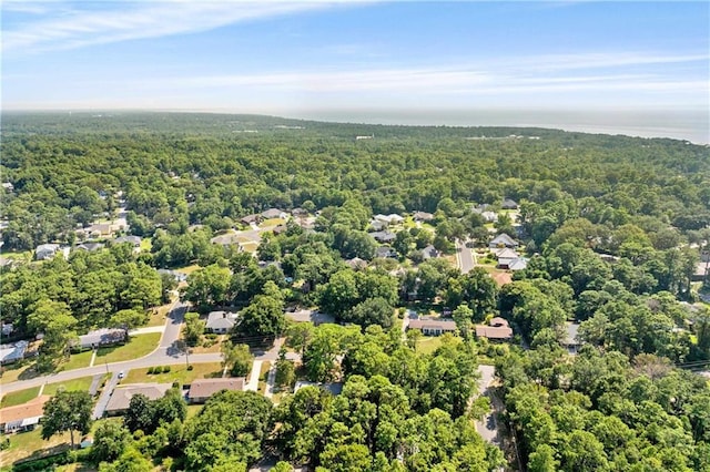 birds eye view of property with a forest view