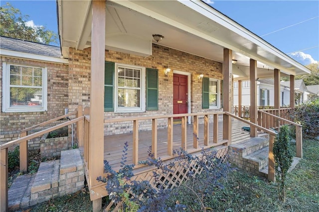 property entrance featuring covered porch