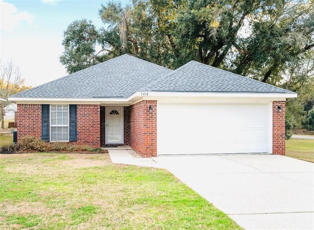 ranch-style house with a garage and a front yard