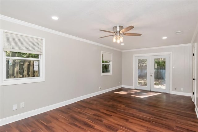 unfurnished room featuring french doors, ornamental molding, a wealth of natural light, and dark wood-type flooring