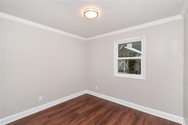 empty room with ornamental molding and dark wood-type flooring