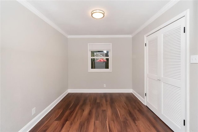 unfurnished bedroom with a closet, dark hardwood / wood-style flooring, and ornamental molding